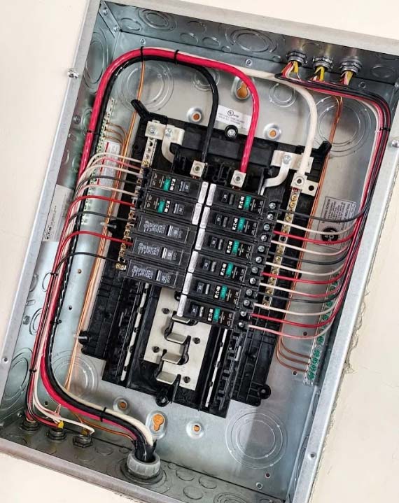 A close-up shot of a main circuit breaker inside a modern panel.