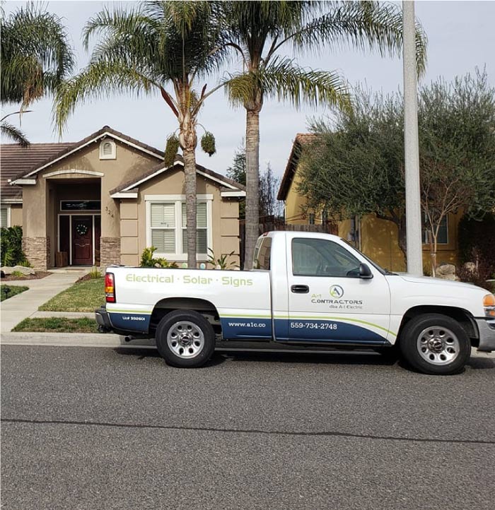 The A-1 Contractors service van parked in a Hanford, CA neighborhood, ready to provide prompt service as the local Electrician in Hanford.