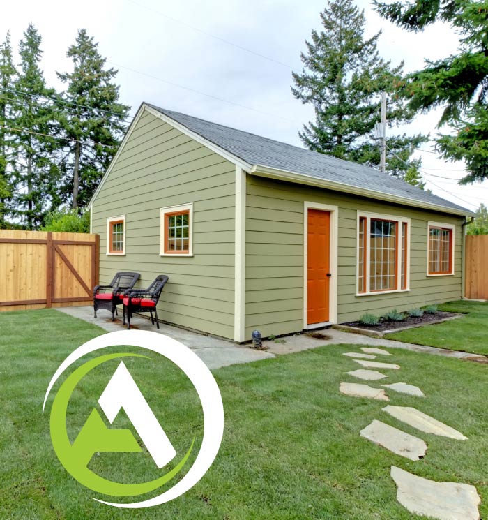 view of a backyard property with a newly completed backyard cottage-style ADU in Fresno, CA.
