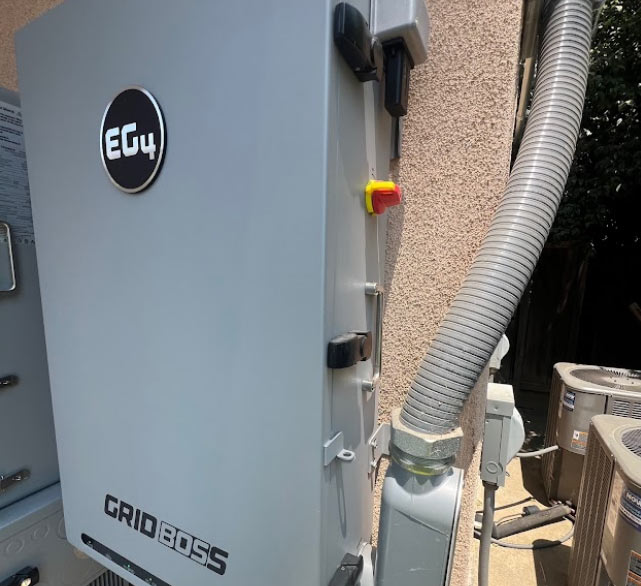 A close-up view of an EG4 GRID BOSS home battery backup system installed by A-1 Contractors.