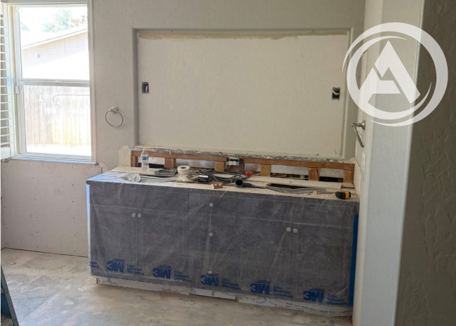 Professional contractors installing custom cabinets and countertops