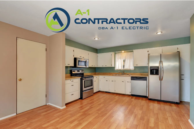 Budget-friendly kitchen with white cabinets, wood flooring, and stainless steel appliances, illustrating a minor kitchen update.