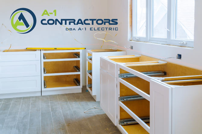How Much to Remodel a Kitchen? Close-up view of base cabinets and wall framing during a kitchen remodel, showing the electrical and structural work required by general contractors.